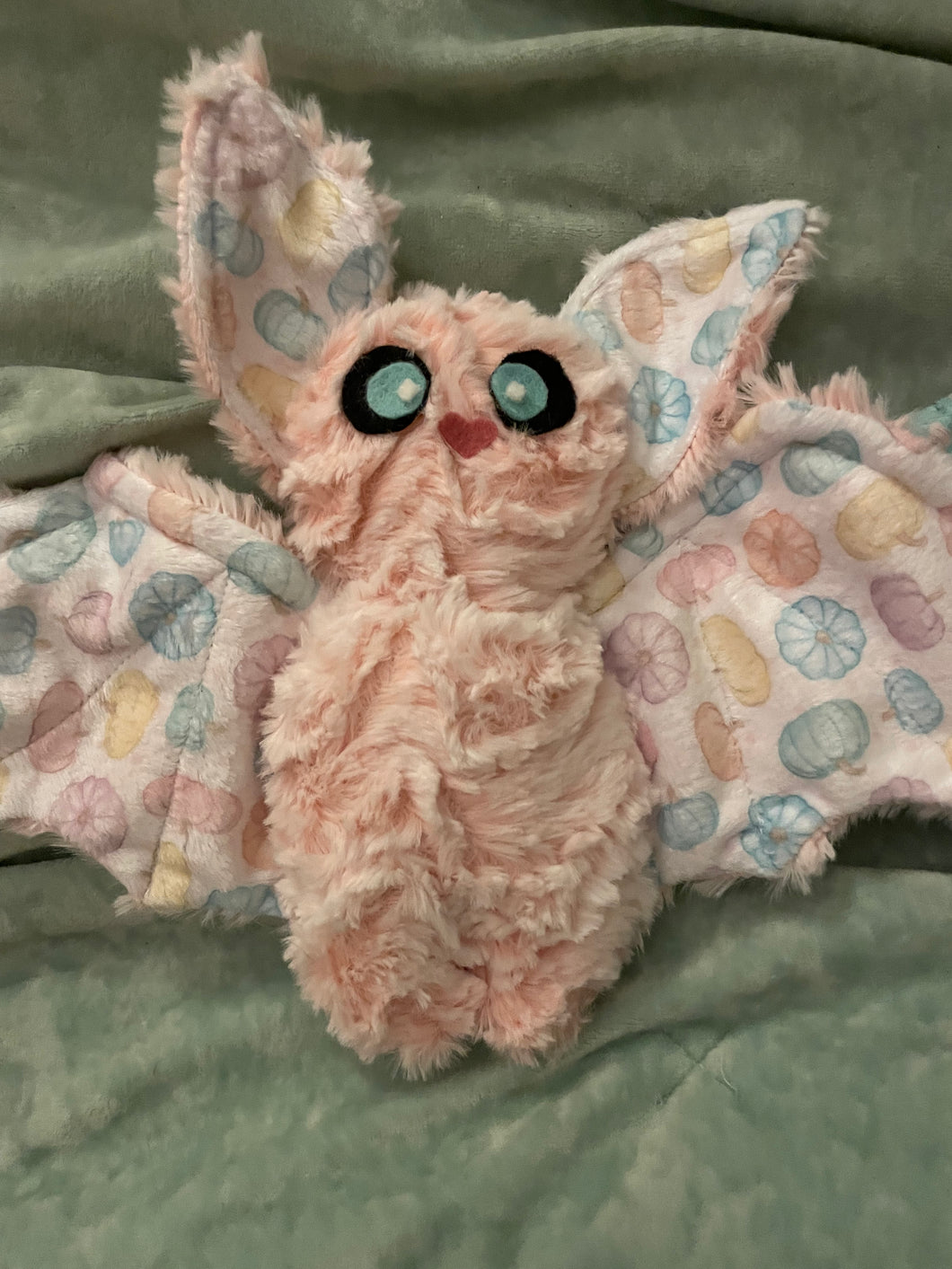 Small coral/cream bat with pumpkins