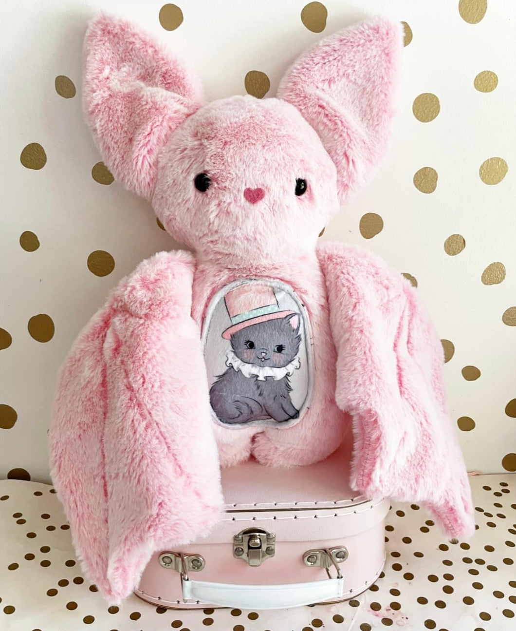 Large pink frosted bat with cat belly