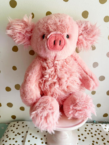 Coral on coral plush pig