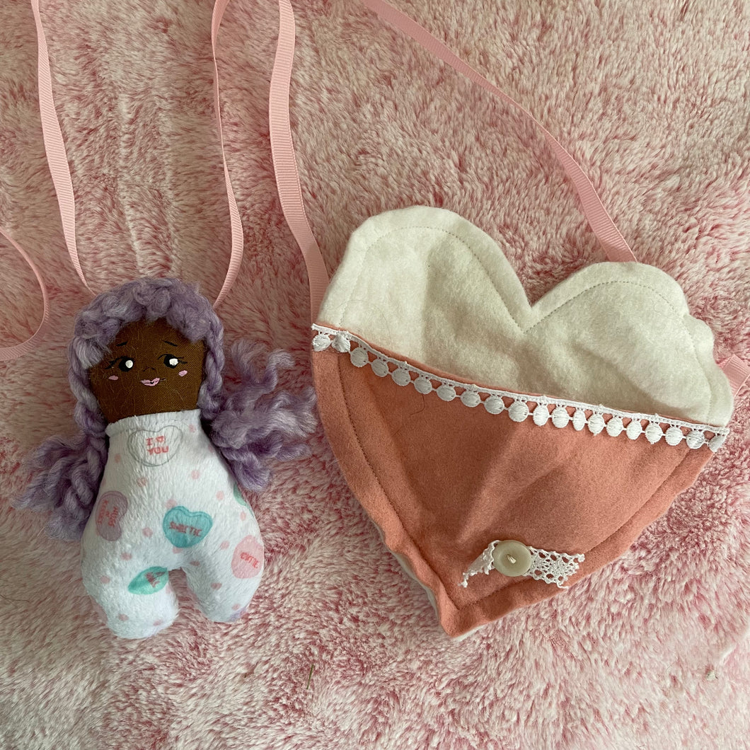 Purple hair doll’s doll with heart bag