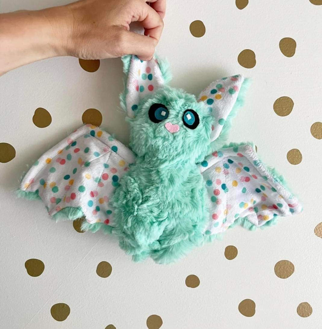 Mint green bat with dots