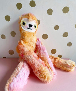 Pink and orange baby sloth