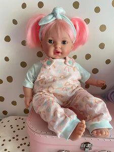 16” pink hair doll in rainbow overalls
